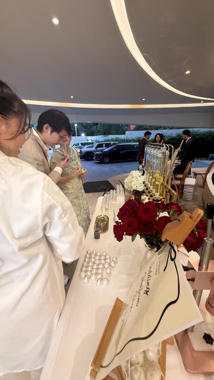 Wedding guests choosing scents at the fragrance bar